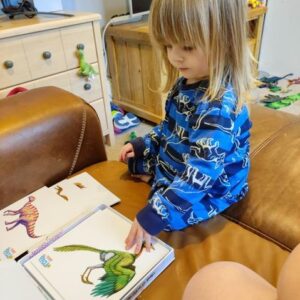 Little girl learning about Dinosaurs